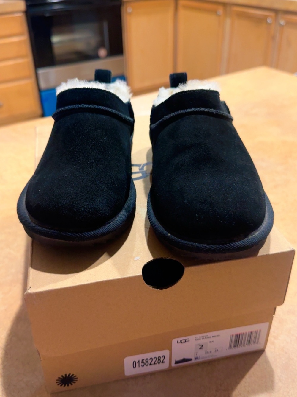 UGG Kids Black Suede Slip-On Clog with Shearling Trim